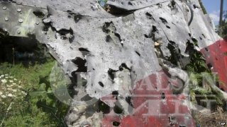 “MH17”-г пуужин харван унагаасныг нотлох шинэ баримт олджээ